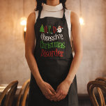 Obsessive Weihnachtskrankheit Funny Holiday Schürze<br><div class="desc">ABl. Obsessive Weihnachtskrankheit Schürze in Schwarz mit grünen,  roten und weißen Schriften. Ein lustiges Weihnachtsgeschenk mit einem niedlichen Weihnachtsbaum und dem Weihnachtsmann zur Dekoration der Worte. Feiertag Spaß anwesend.</div>