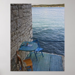 Oceanside seating for two at tiny outdoor cafe, poster