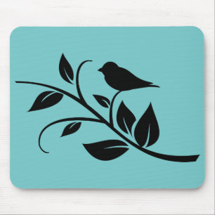 Oiseau sur un tapis de souris feuillu de branche