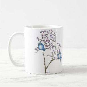 Oiseaux et tasse de fleurs