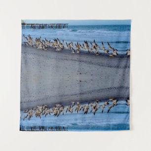Oiseaux volant près de la Tapisserie Océanique