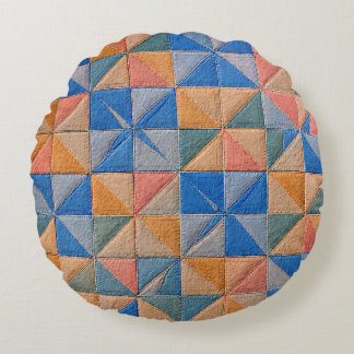 orange and blue quilt rundes kissen