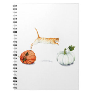 Orange Cat Jumping between Pumpkins Notizblock