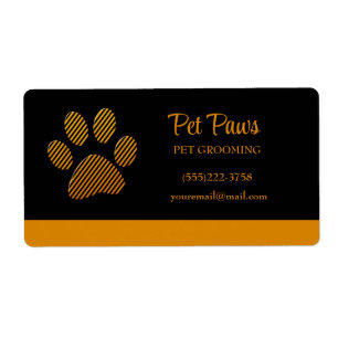 Orange Dog Paw auf schwarzem Pet Grooming Service 