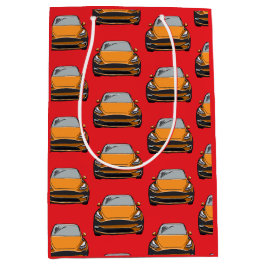 Orange Electric Vehicle SUV Car Red Background Mittlere Geschenktüte