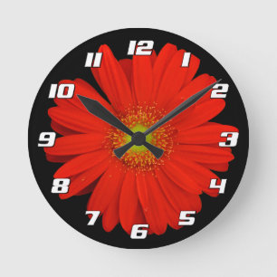 Orange Gerbera Daisy Blume auf schwarz mit Zahlen Runde Wanduhr