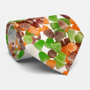 Orange grüne rote Kaugummibonbons gestreut Zuckerm Krawatte