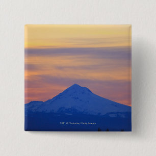 Orange Himmel-Schnee mit einer Kappe bedeckter Button