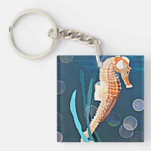 Orange Seahorse contre la mer avec des bulles