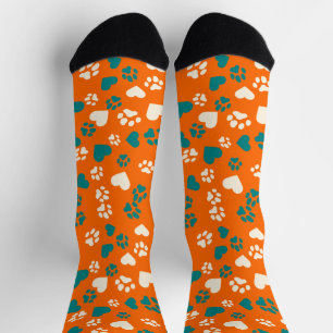 Orange Socken mit Türkis- und Creme-Pfotenabdrücke