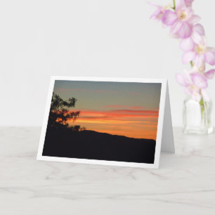Orange Sonnenuntergangs-Silhouetten-Landschaftskar Karte