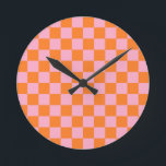 Orange und Rosa Runde Wanduhr<br><div class="desc">Abstrakte digitale Kunst von orangen und rosa Quadraten in einer karierten Formation.</div>