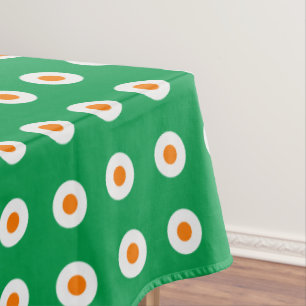 Orange/weiße Punkte auf grün Tischdecke