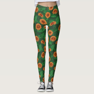 Orange Zinnia Blume, grüne Blätter auf dunkelgrün Leggings