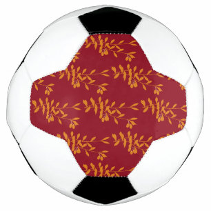 Orangefarbene Blätter der Silhouette auf rot Fußball