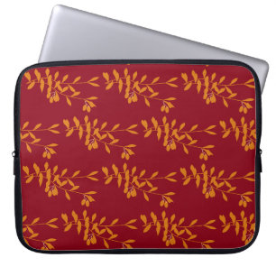Orangefarbene Blätter der Silhouette auf rot Laptopschutzhülle
