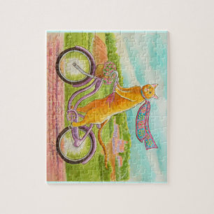 Orangefarbene Katze auf einem Lila Fahrrad