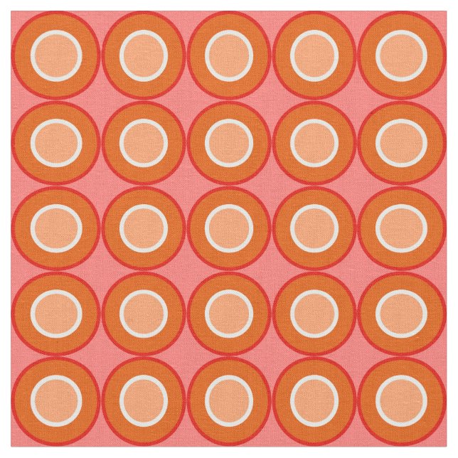 Orangefarbene Orangennüsse mit Blütenfülle Stoff (Nahaufnahme)