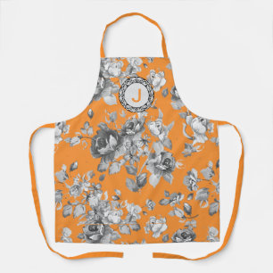 Orangefarbene Schürze mit Blume und Monogramm