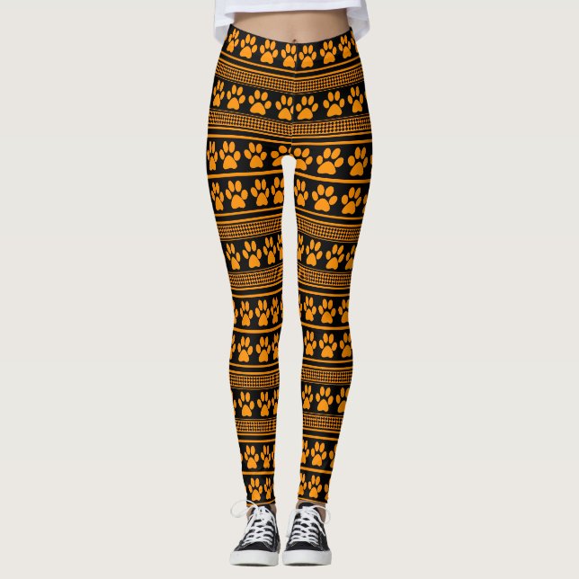 Orangefarbene schwarze Pfotenmuster-Leggings Leggings (Vorderseite)