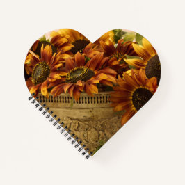 Orangefarbene Sonnenblumen im Körbchen Notizbuch