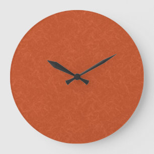 Orangefarbene texturierte Oberfläche mit wirbelnde Große Wanduhr