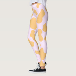 Orangefarbene und rosa Kuh Printästhesie Leggings