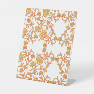 orangefarbene und weiße Tapeten mit Blumenmotiv Sockelschild