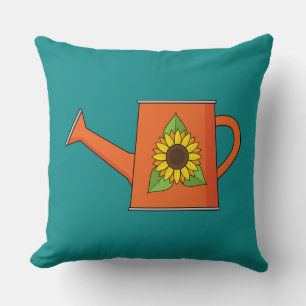 Orangefarbene Wasserdose mit Sonnenblumen Kissen