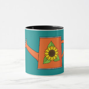 Orangefarbene Wasserdose mit Sonnenblumen Tasse