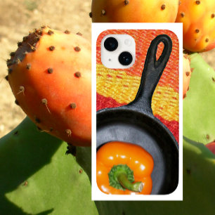 Orangefarbener Pfeffer in schwarzem Bratpfanne, fa iPhone 16 Hülle