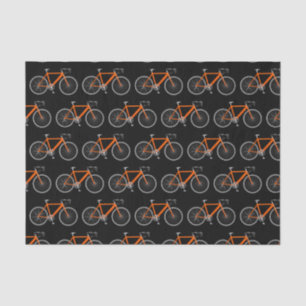 Orangefarbenes Fahrrad auf schwarzem Gewebe Seidenpapier