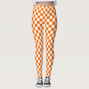 Orangefarbenes Muster eines Karos Leggings