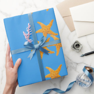 Orangene Seesterne Geschenkpapier