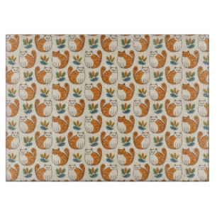 Orangene und weiße Katzen im naiven Kunststil Schneidebrett