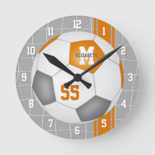 Orangengraue Mannschaftsfarben Lackstreifen Fußbal Runde Wanduhr