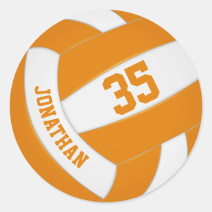 Orangenweiße Mannschaft hält Jungen Volleyball Runder Aufkleber