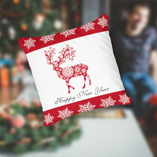 Oreiller à jet de motif de flocon rouge