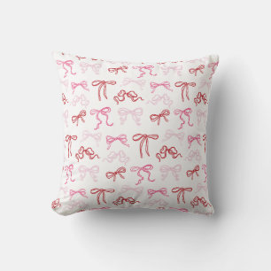 Oreiller à motif de nœud coquet rose et rouge