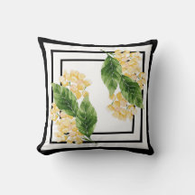 Oreiller noir et blanc avec fleurs jaunes