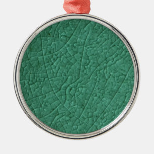 Ornament aus grünem Stein Metall