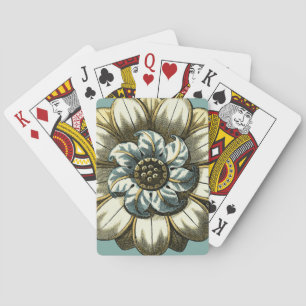 Ornamentales Blumenmedaillon auf hellblauem Hinter Spielkarten