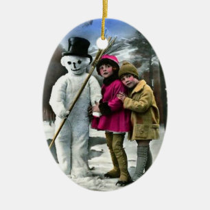 ORNEMENT EN CÉRAMIQUE LES ENFANTS AVEC LA NEIGE