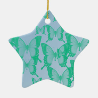 Ornement En Céramique papillons verts en arrière - plan bleu