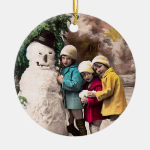 ORNEMENT ROND EN CÉRAMIQUE LES ENFANTS AVEC LA NEIGE