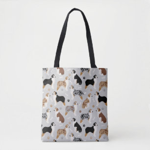 Os bergers australiens et Sac fourre-tout gris des