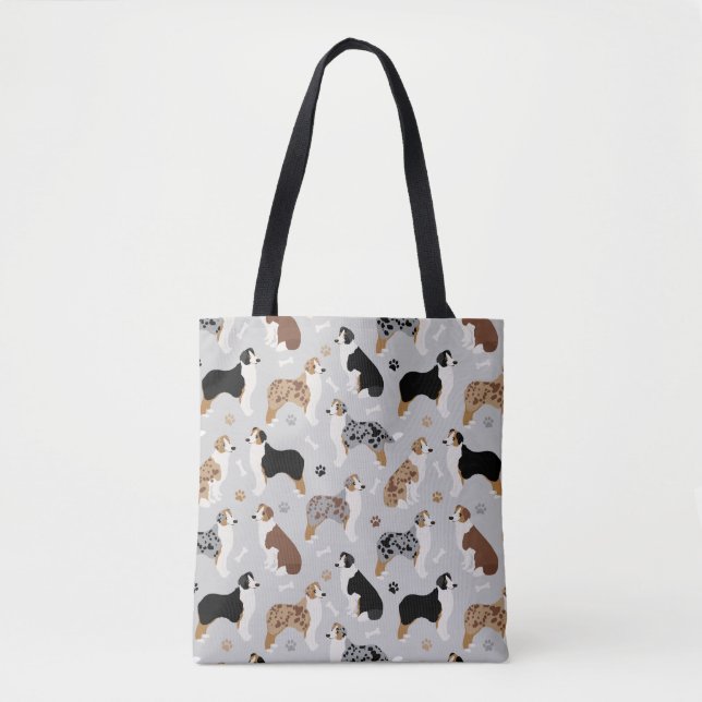 Os bergers australiens et Sac fourre-tout gris des (Devant)