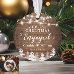 Our First Christmas Engaged Rustic Pine Tree Photo Ornament<br><div class="desc">***** Don't forget to upload your favorite photo on the back. If you don't need the photo placement, you can remove it using design tool ***** Celebrate your First Christmas Engaged with this Rustic Wood Look String Lights Pine Trees Photo Ornament. Adding a favorite photo and text to this graceful...</div>