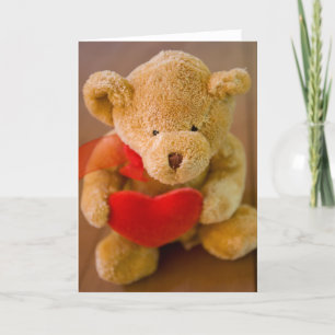 Ours en peluche farci tenant une carte de voeux ca