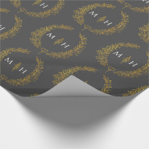 Ovalblatt-Monogramm-Zeichnung in Gold auf dunkelgr Geschenkpapier